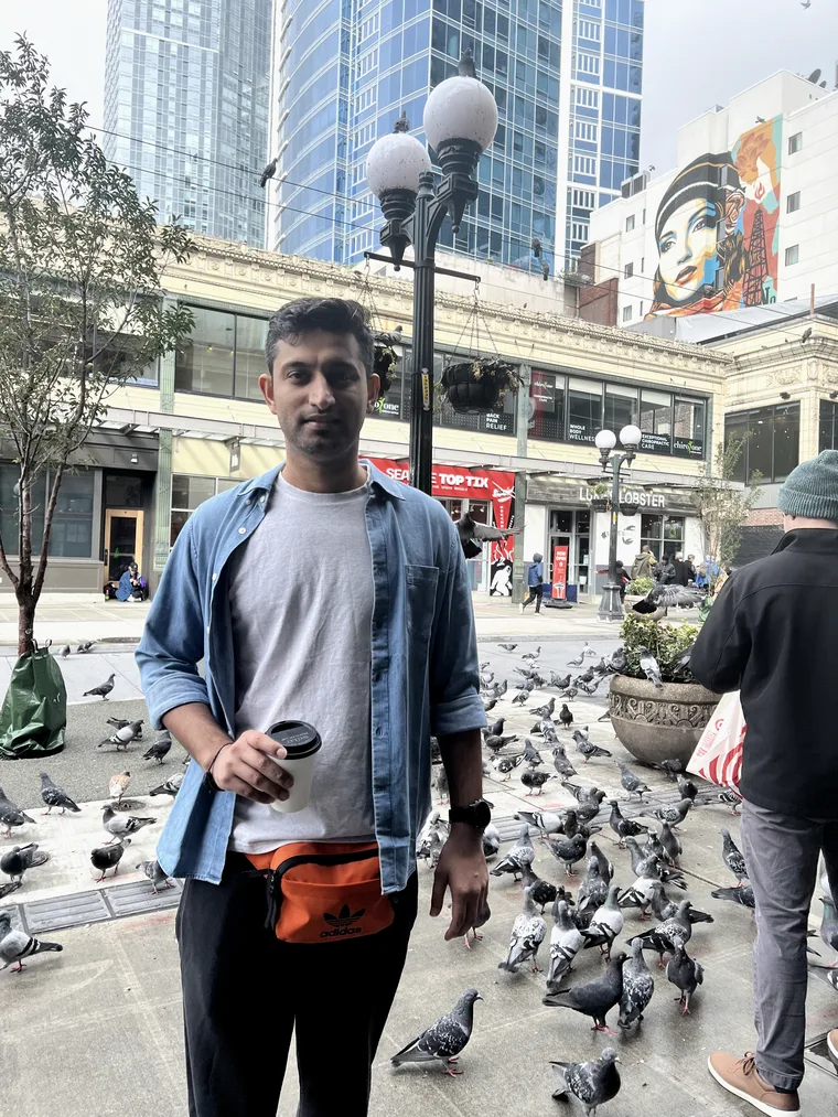 Akshit with a coffee in downtown Seattle